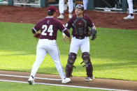 Mississippi State pitcher Will Bednar (24) celebrates with catcher Logan Tanner (19) after a double play against Vanderbilt during the first inning in Game 3 of the NCAA College World Series baseball finals, Wednesday, June 30, 2021, in Omaha, Neb. (AP Photo/John Peterson)