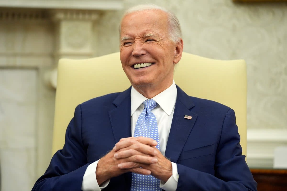 A group of Joe Biden’s closest aides are mulling how to convince him to exit the presidential race  (AP)