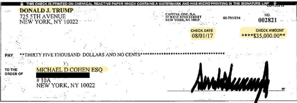 This image provided by Michael Cohen's attorney, Lanny Davis, shows copies of two checks that Cohen presented to the House Oversight and Reform Committee on Wednesday, Feb. 27, 2019 in Washington.