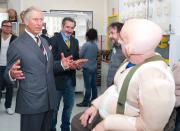 WELLINGTON, NEW ZEALAND - NOVEMBER 14: Prince Charles, Prince of Wales meets with Peter Hambleton, who plays the Dwarf Gloin in the new 'Hobbit' film, at Weta Workshop on November 14, 2012 in Wellington, New Zealand. The Royal couple are in New Zealand on the last leg of a Diamond Jubilee that takes in Papua New Guinea, Australia and New Zealand. (Photo by Jeff McEwan - PoolGetty Images)