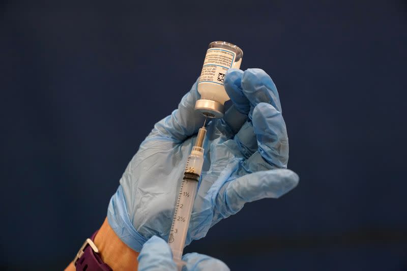 FILE PHOTO: COVID-19 vaccines are administered in Martinsburg, West Virginia