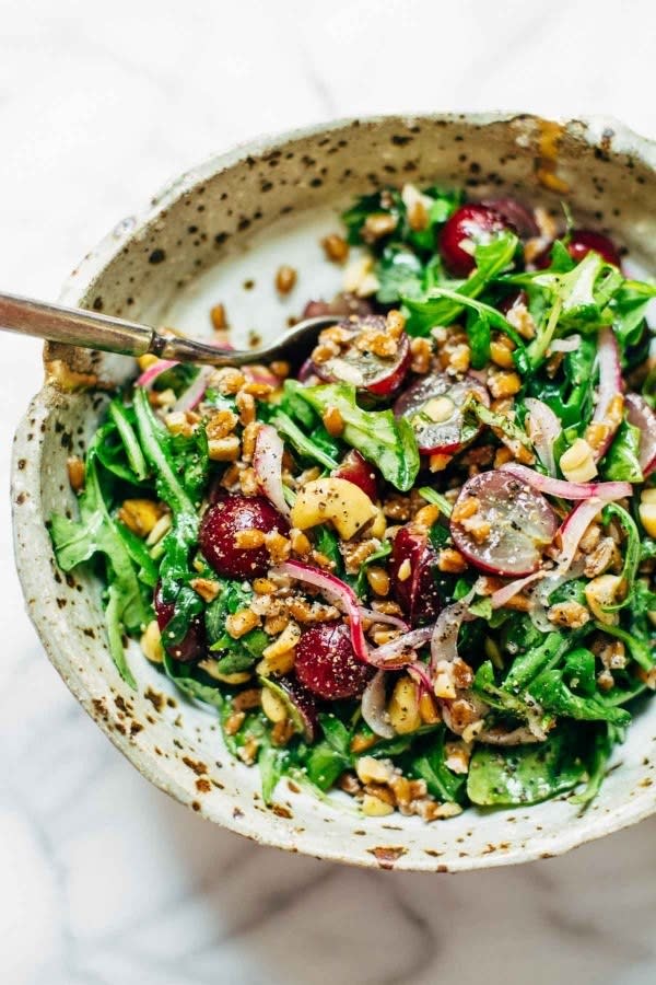 How about adding red grapes to salad for a pop of sweetness? Recipe: Arugula Salad With Grapes and Black Pepper Vinaigrette 