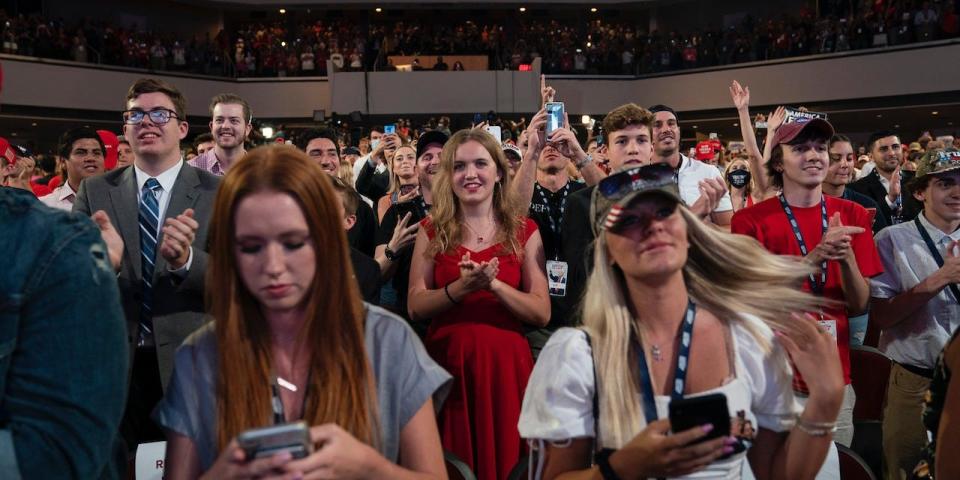 Supporters of President Donald Trump cheer as he arrives to a group of young Republicans at Dream City Church, Tuesday, June 23, 2020, in Phoenix.