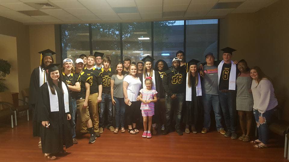 Students posed for a photo as a memento from the touching ceremony. Source: Julie Northcott/ Facebook