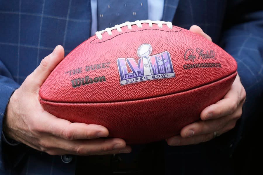 FILE – Nevada Republican Gov. Joe Lombardo holds an NFL football with the Super Bowl LVIII logo on it after the Arizona Super Bowl Host Committee handed off the ball to the Las Vegas Super Bowl Host Committee for Super Bowl LVIII during an NFL Super Bowl football game news conference in Phoenix, Monday, Feb. 13, 2023. (AP Photo/Ross D. Franklin)