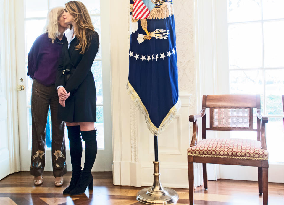 Hope Hicks, above, with her blazer coat and thigh-high boots. (Photo: Getty Images)