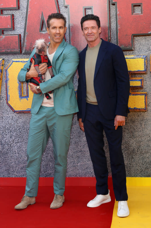 LONDON, ENGLAND - JULY 11: Ryan Reynolds, Hugh Jackman and Peggy as "Dogpool" attend the "Deadpool & Wolverine" UK Sneak Peek at the Eventim Apollo on July 11, 2024 in London, England. (Photo by Lia Toby/Getty Images)<p>Lia Toby/Getty Images</p>