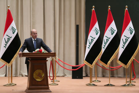 REFILE - CORRECTING GRAMMAR Barham Salih, Iraq's newly elected president, delivers a speech at the parliament headquarters, in Baghdad, October 2, 2018. Iraqi Parliament Office/Handout via REUTERS