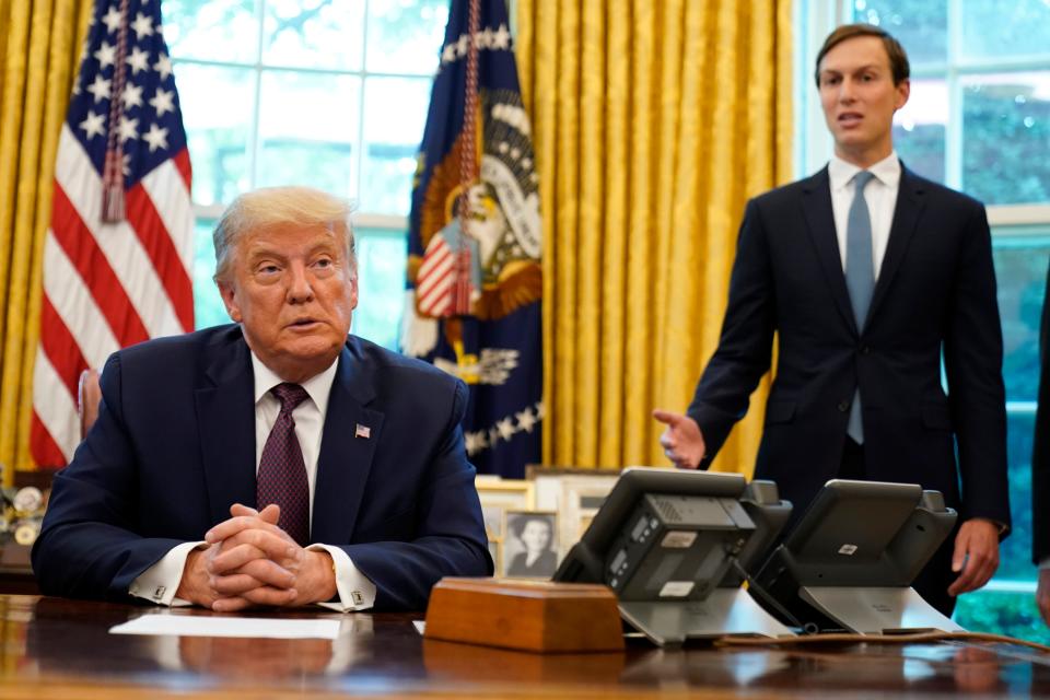 President Donald Trump listens as Jared Kushner speaks in the Oval Office of the White House on Friday, Sept. 11, 2020, in Washington.