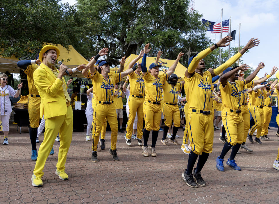 Savannah Bananas team owner Jesse Cole (far left) leads his team singing a rendition of 