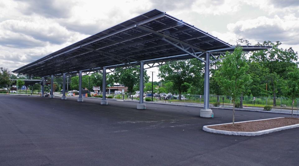 The new parking lot outside the emergency room entrance at Brockton Hospital has a roof with solar panels, seen here on Wednesday, Aug. 2, 2023. The hospital has been shuttered since a 10-alarm fire on Feb. 7, 2023.