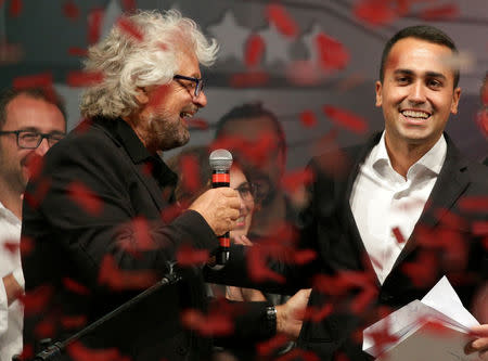 5-Star movement founder Beppe Grillo (L) stands next to Luigi Di Maio during a gathering in Rimini, Italy, September 23, 2017. REUTERS/Max Rossi