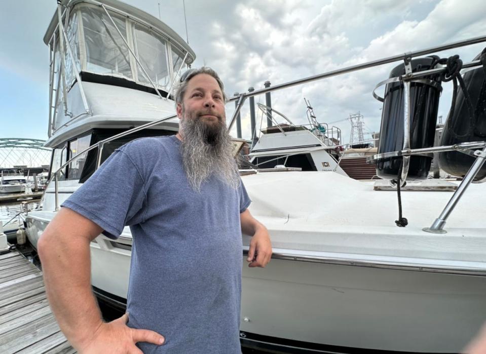Bill Beggs, owner of Seekonk’s Boneyard Barbeque and one of Stacy Rae’s Providence Marina neighbors, stands by his own sport fishing boat, where he often spends the night.