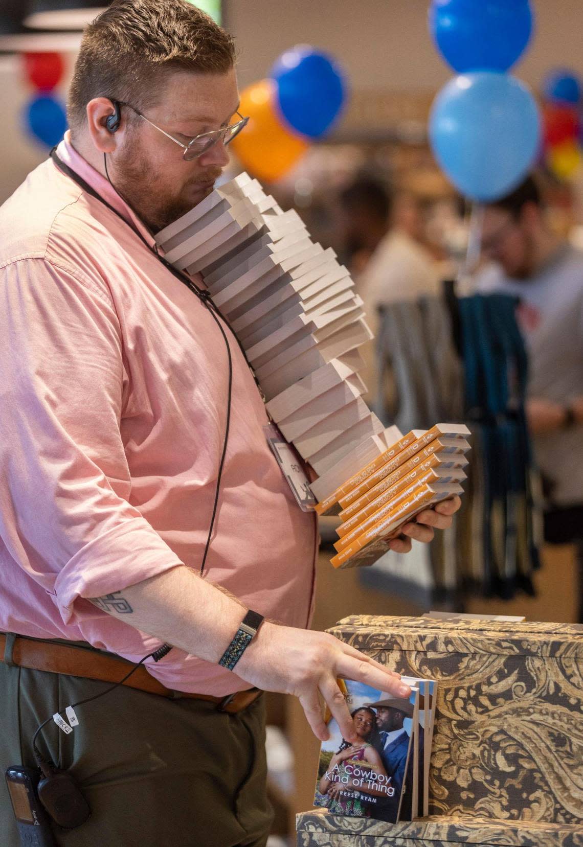 Barnes & Noble employee Ron Sehl stocks the shelves at the new Barnes & Noble store which opened in the Shoppes of Kildare at 1311 Kildaire Farm Road on Wednesday, July 5, 2023 in Cary, N.C