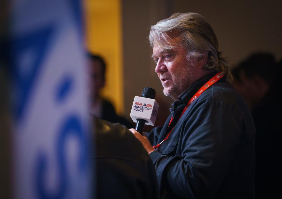Steve Bannon broadcasts outside of the convention hall during the Conservative Political Action Conference, CPAC 2024, at the Gaylord National Resort & Convention Center in National Harbor, Md. on Feb 22. 2024. Trump's former campaign and White House strategist was convicted in 2022 of contempt of Congress. Bannon was charged after defying a demand to appear before a U.S. House of Representatives committee investigating the Jan. 6, 2021, U.S. Capitol attack by Trump supporters seeking to prevent Congress from certifying Democrat Joe Biden's November 2020 election victory. Bannon, who has appealed, has yet to be sentenced. Bannon also faces New York state charges of money laundering and conspiracy, accused by prosecutors of swindling Trump supporters in a scheme involving donations solicited to help build his promised wall along the U.S.-Mexico border. Bannon, who pleaded not guilty, is due to go on trial in May 2024. He also was charged in federal court over that same project, but the case ended when Trump pardoned Bannon in the final hours of his presidency in 2021.