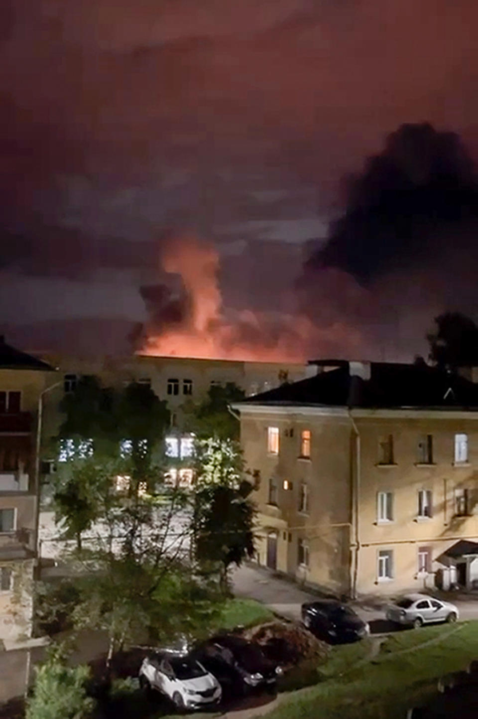 This photo taken from video provided by the official telegram channel of Pskov region governor Mikhail Vedernikov, shows smoke billowing over the city and a large blaze in Pskov, Russia, on Aug. 29, 2023. Russian officials accused Ukraine of targeting six Russian regions early Wednesday in what appeared to be the biggest drone attack on Russian soil since Moscow sent troops into Ukraine 18 months ago. (Pskov region governor Mikhail Vedernikov official telegram channel via AP)