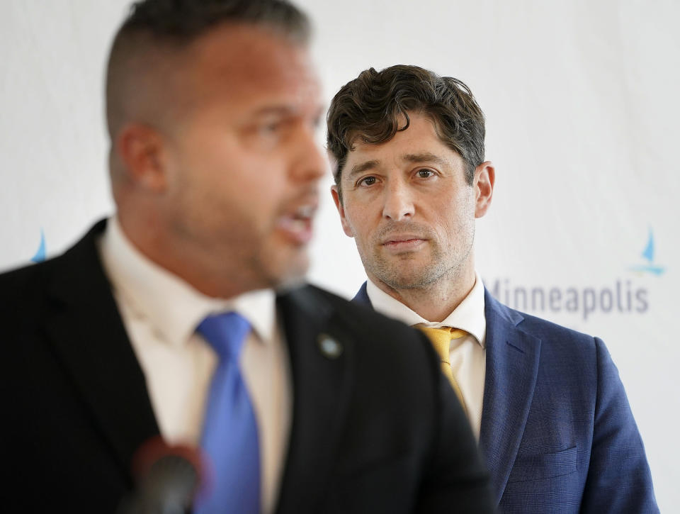 Minneapolis Mayor Jacob Frey, right, listens to nominee for Minneapolis Police Department police chief Brian O'Hara, left, currently the deputy mayor of Newark, N.J., address the media during a press conference at the Minneapolis Public Service Building Thursday, Sept. 29, 2022 in Minneapolis. Frey has announced that he will nominate former public safety director O'Hara from Newark, as his top pick for police chief. (David Joles/Star Tribune via AP)