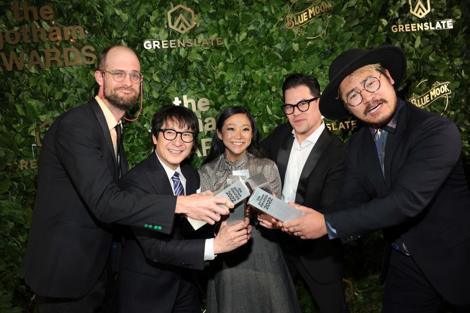 Daniel Scheinert, left, Ke Huy Quan, Stephanie Hsu, Jonathan Wang and Daniel Kwan pose with awards for &quot;Everything Everywhere All at Once&quot; at the 2022 Gothams.