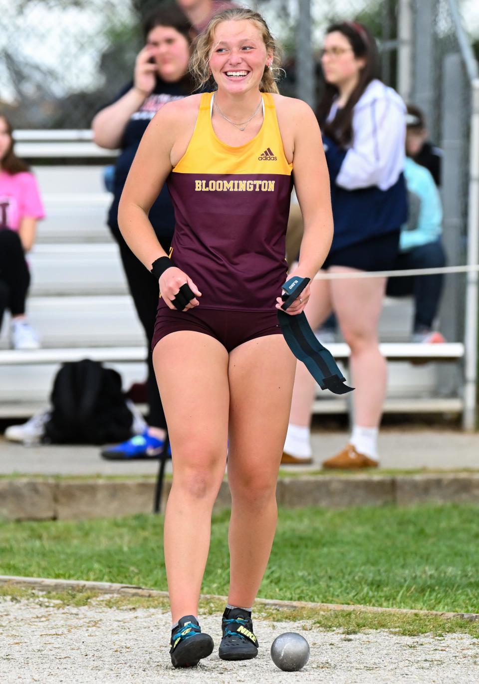 Bloomington North’s Hadley Lucas smiles after throwing a school and meet record 54-10¾ in the girls' shot put during the Conference Indiana track meet at Bloomington North on Friday, April 26, 2024.