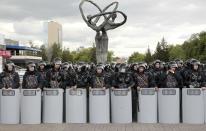 Kazakh police block an area to prevent protests against presidential elections in Nur-Sultan, the capital city of Kazakhstan, on Monday June 10, 2019. Sunday's vote was marred a police crackdown on protesters who took to the streets against what they see as a mockery of democracy. (AP Photo/Alexei Filippov)