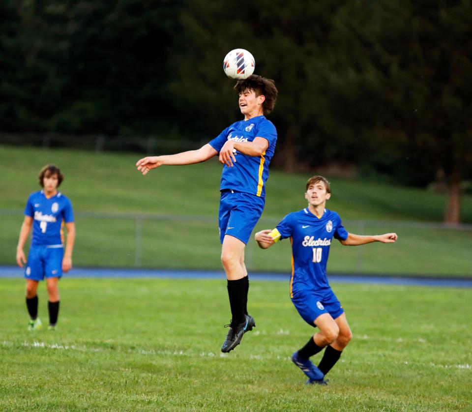 Midfielder Logan Lyon goes up for a header as Andrew Van Meter keeps tabs during Philo's 2-0 win against visiting Morgan on Thursday night in Duncan Falls.