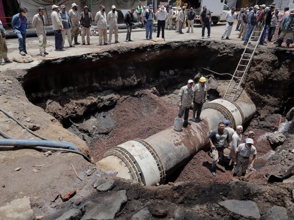 Workers repair a sinkhole in Iztapalapa in Mexico City.