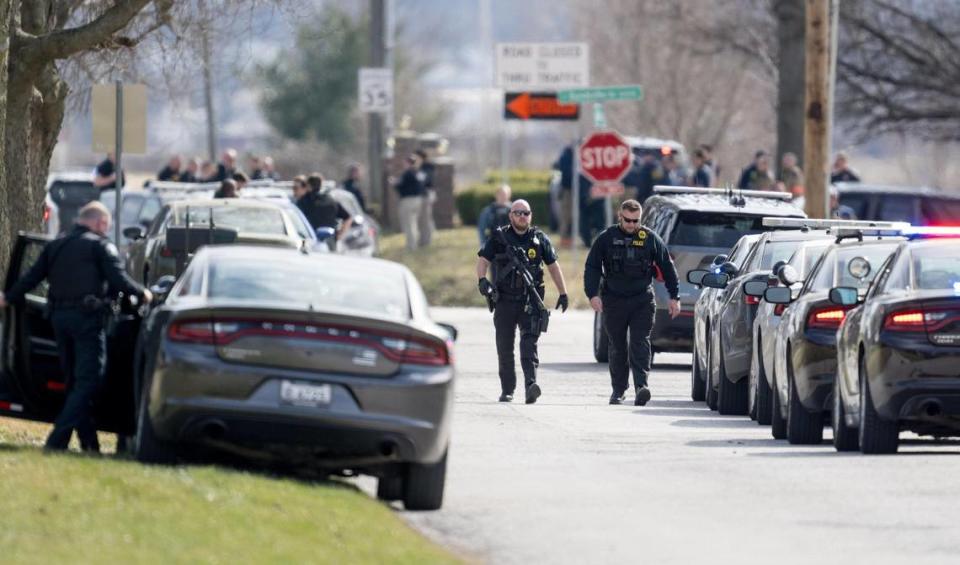 Law enforcement officials and medical personnel work the scene of an officer involved shooting near the intersection of Elsea Smith Road and Budschu Road on Thursday, Feb. 29, 2024, in Independence.