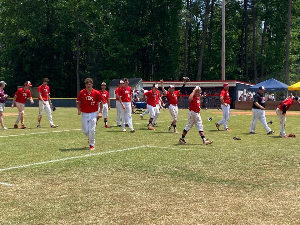 The Burlington School baseball team celebrates winning the NCISAA Class 2-A state championship Saturday with a Game 2 victory against Westchester Country Day in the best-of-3 series.