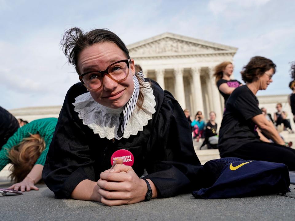 Alice Wisbiski, 22, a supporter of Ruth Bader Ginsburg, performs exercise planks in celebration of the Supreme Court associate justice’s 86th birthday in Washington, U.S., March 15, 2019.