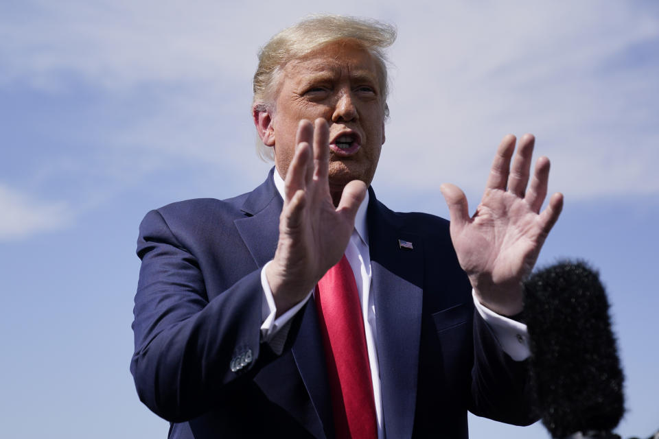 President Donald Trump talks to reporters at Phoenix Sky Harbor International Airport, Monday, Oct. 19, 2020, in Phoenix. (AP Photo/Alex Brandon)