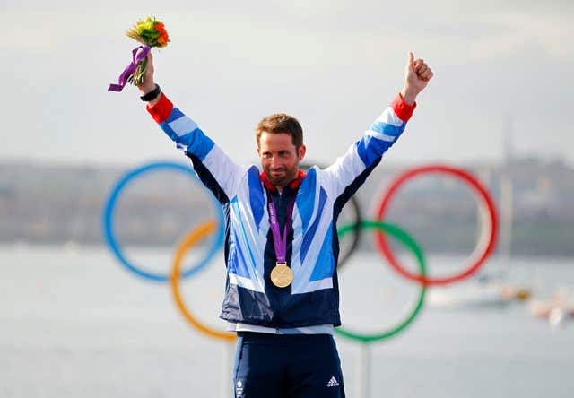 Ben Ainslie celebrates on the podium