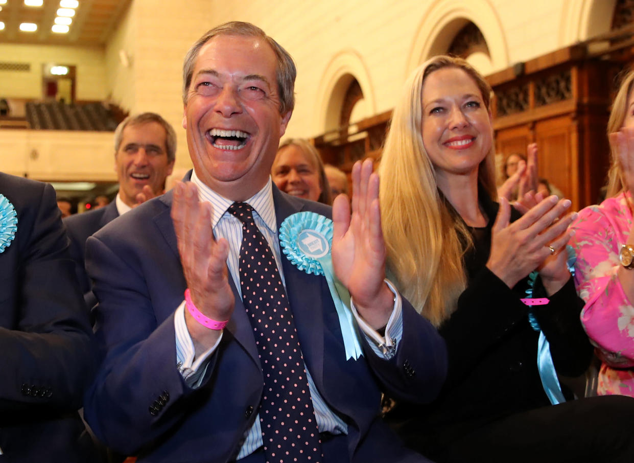 Brexit Party leader Nigel Farage (left) celebrates being elected after the European Parliamentary elections count at the Guildhall in Southampton.