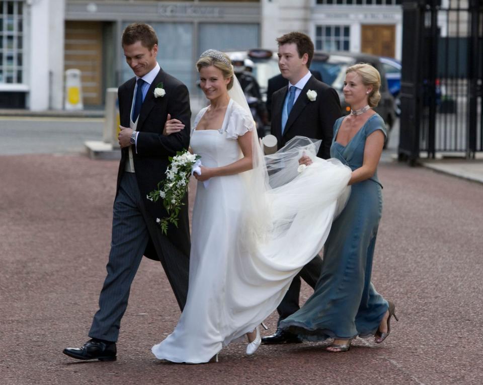 <p>Lady Rose's simple white gown featured short ruffled sleeves and an open neckline.</p>