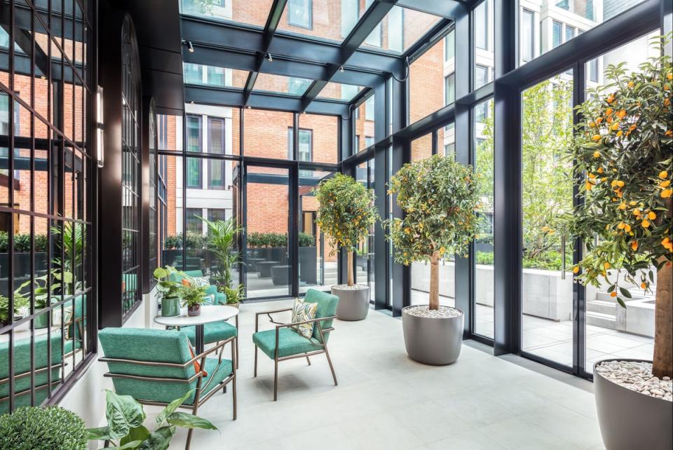 The new one-to-four-bedroom apartments are serviced by a five-star concierge service with access to a members club and an Orangery, pictured (DBOX)