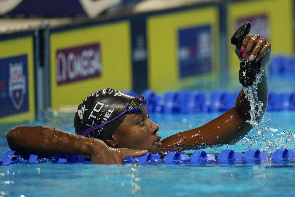 Simone Manuel reacts after the women's 50 freestyle during wave 2 of the U.S. Olympic Swim Trials on Saturday, June 19, 2021, in Omaha, Neb. (AP Photo/Jeff Roberson)