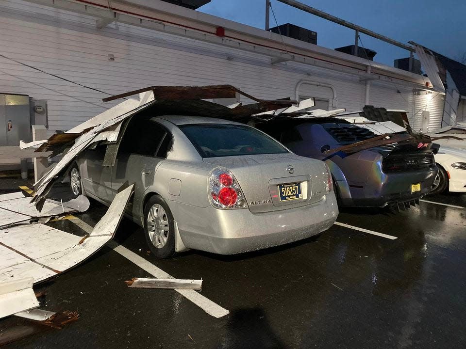 A tornado damaged cars and blew down trees outside the Harvest Seasonal Grill at the Village at Newtown on Saturday night. The National Weather Service confirmed an EF1 tornado blew cut a four mile path through Newtown Township and Borough on Saturday evening