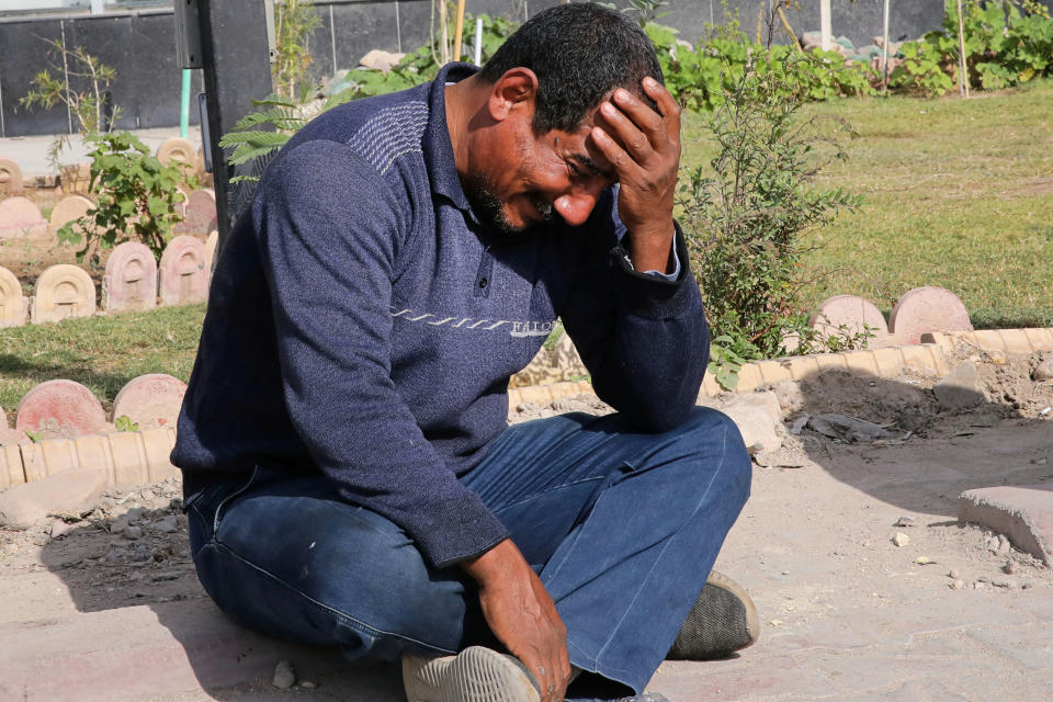 A man reacts at the site of an explosion in Basra, Iraq, Tuesday, Dec. 7, 2021. The explosion rocked the center of Iraq’s southern city of Basra, killing at least four people and wounding several others. Local news reports initially reported a car bomb, but the governor of Basra told reporters on the scene that a motorcycle had exploded. (AP Photo/Nabil al-Jurani)