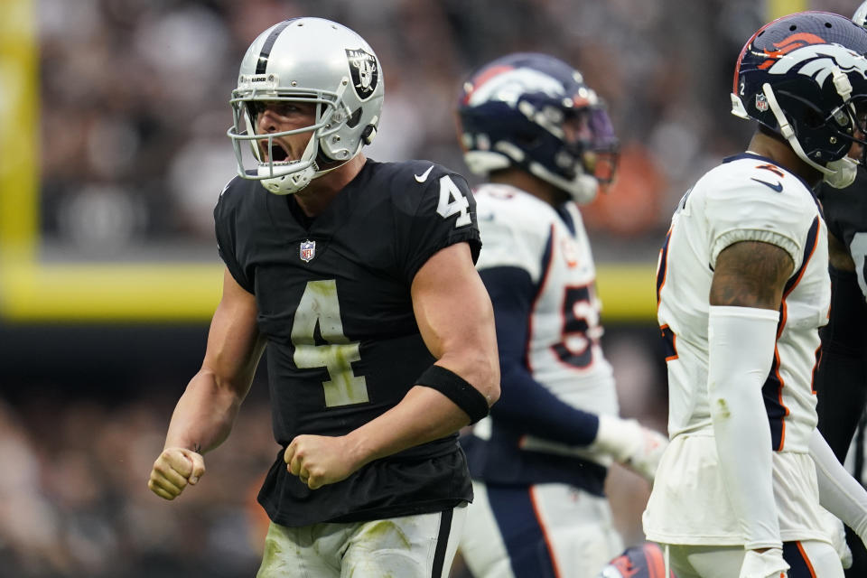 Las Vegas Raiders quarterback Derek Carr (4) celebrates a first down against the Denver Broncos during the first half of an NFL football game, Sunday, Oct. 2, 2022, in Las Vegas. (AP Photo/Abbie Parr)