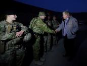 Britain's Foreign Secretary Boris Johnson (R) shakes hands with British soldiers during his visits from Camp Qargha in Kabul, Afghanistan November 26, 2016. REUTERS/Mohammad Ismail