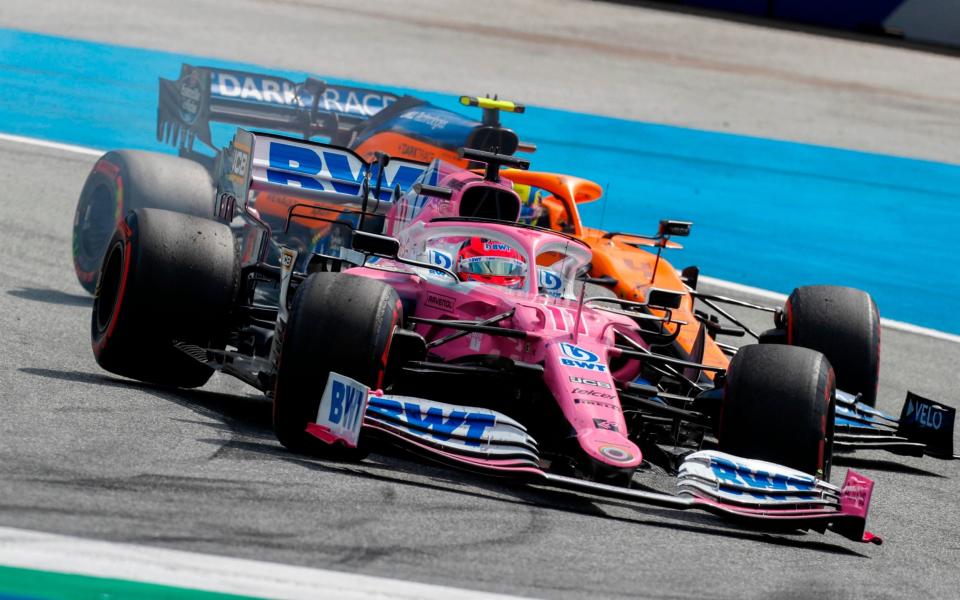 Racing Point's Mexican driver Sergio Perez steers his car in front of McLaren's British driver Lando Norris during the Formula One Styrian Grand Prix race on July 12, 2020 in Spielberg, Austria - AFP/ DARKO BANDIC