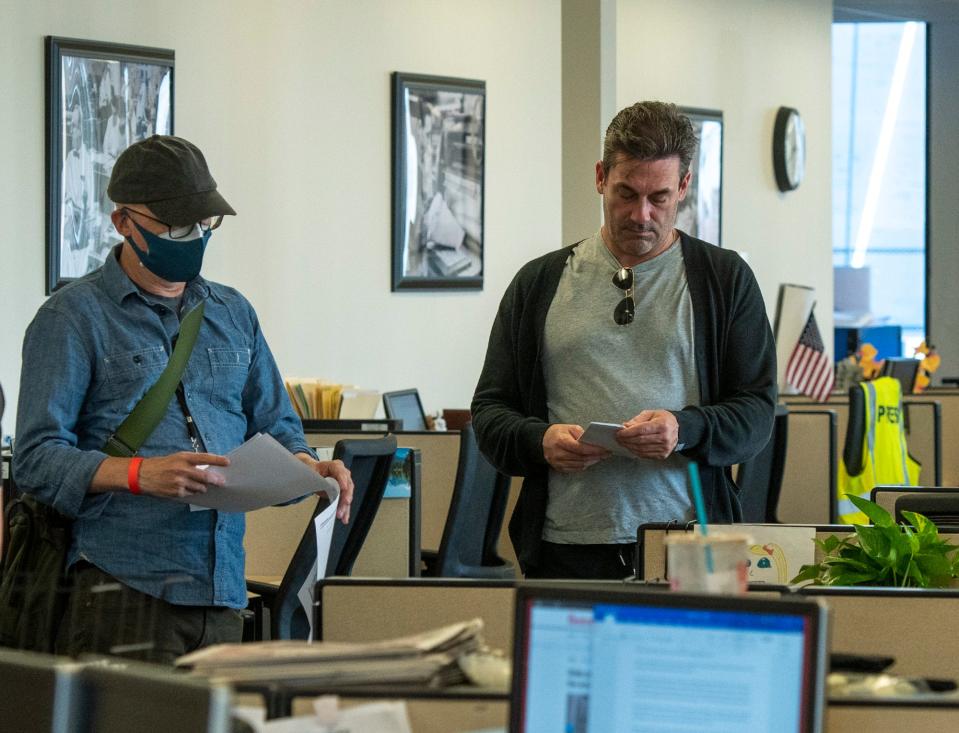 Director Greg Mottola and actor John Hamm prepare for a scene being shot in the T&G newsroom on June 29, 2021.