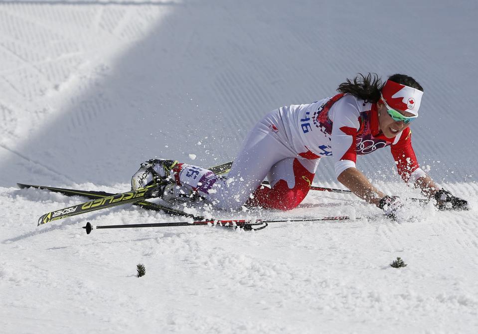 Canada's Emily Nishikawa falls on the ground after competing in the women's cross-country 30 km mass start free event at the Sochi 2014 Winter Olympic Games in Rosa Khutor February 22, 2014. REUTERS/Carlos Barria (RUSSIA - Tags: SPORT SKIING OLYMPICS)