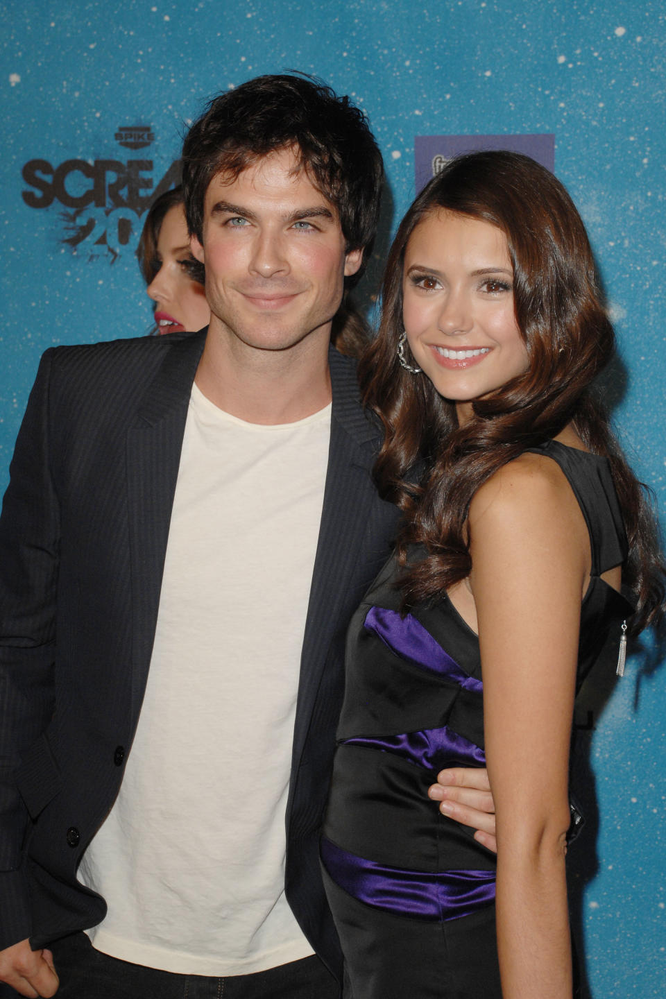 Ian Somerhalder with his arm around Nina Dobrev