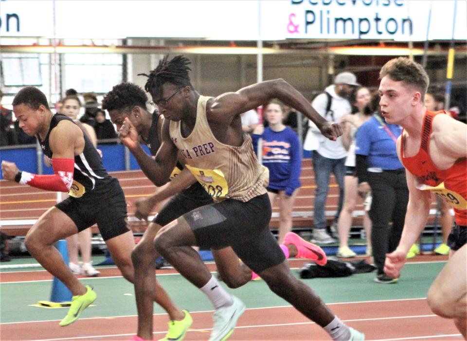 Iona Prep's Marcus Nahim (c) and Briarcliff's Will McLay (r in orange) compete in the boys invitational 55-meter dash during the U.S. Army Officials Hall of Fame track meet at The Armory January 21, 2023. Nahim ran a personal-best and current NY high school-best time for second place. McLay was seventh.