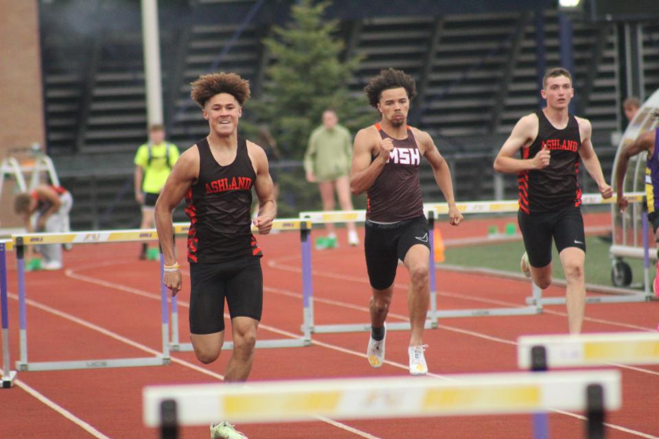 Ashland's Jayden Goings (left) finished second to Mansfield Senior's Aaron Thornton (middle) in the 300 hurdles final at last year's Ohio Cardinal Conference meet. Braydon Martin (right) placed third.