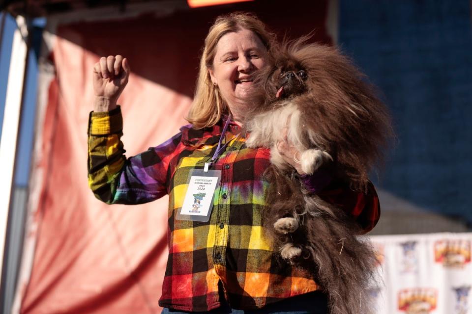 Wild Thang with his owner Ann Lewis after scooping the $5,000 prize (EPA)