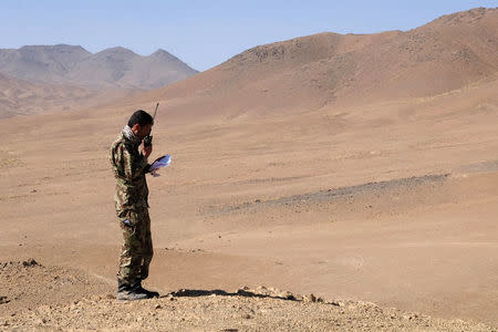 An Afghan Tactical Air Controller practices directing an air strike during an exercise at a range outside Kabul, Afghanistan, October 18, 2016. REUTERS/Josh Smith