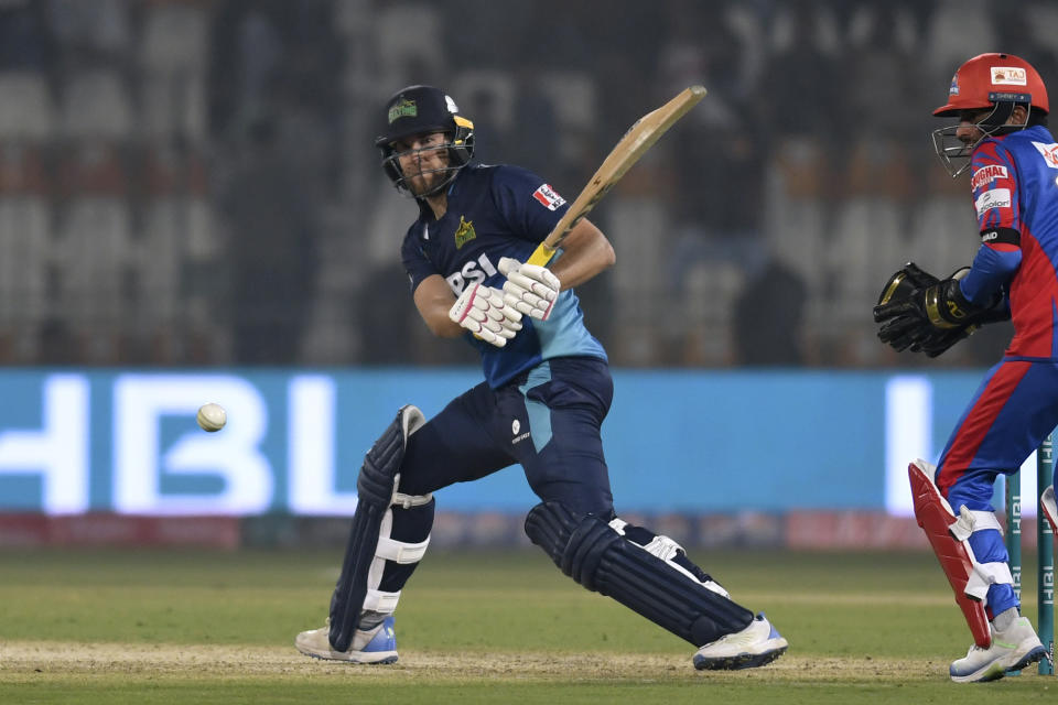 Multan Sultans' Dawid Malan, center, plays a shot during the Pakistan Super League T20 cricket match between Multan Sultans and Karachi Kings in Multan, Pakistan Sunday, Feb. 18, 2024. (AP Photo/M. Khan)