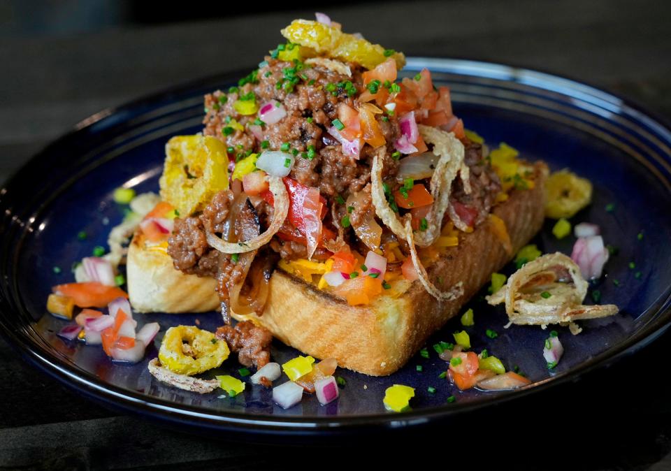 The Vegan Sloppy Joe with Impossible beef, sweet onion and peppers, house BBQ, vegan cheddar, crispy shallots and chilies, and pickled veggies at LP on 1137 N. King Dr. in Milwaukee on Friday, Oct. 27, 2023.