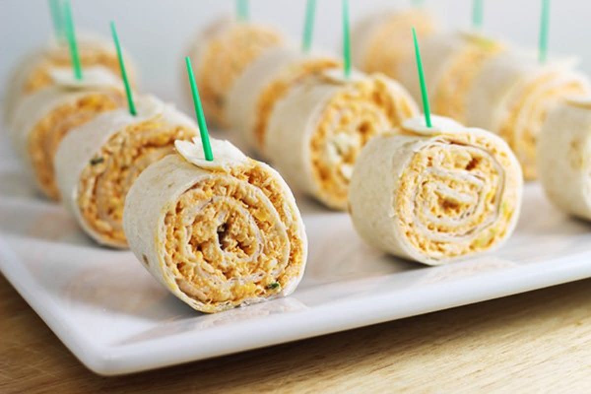 <p>Home Cooking Memories</p><p>Your Super Bowl snack spread is incomplete without these bite-size tortilla pinwheels!</p><p><strong>Get the recipe: <a href="http://homecookingmemories.com/buffalo-chicken-tortilla-pinwheels/" rel="nofollow noopener" target="_blank" data-ylk="slk:Buffalo Chicken Tortilla Pinwheels;elm:context_link;itc:0;sec:content-canvas" class="link rapid-noclick-resp">Buffalo Chicken Tortilla Pinwheels</a></strong></p>